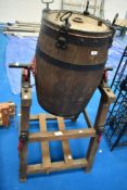 A vintage butter churn and stand