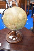 A vintage globe on stand , height approx. 45cm