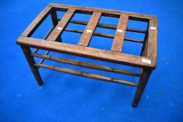 A Victorian mahogany luggage stand having turned frame