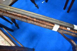 A selection of bamboo and brass curtain poles