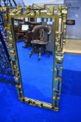 A modern designer gilt frame wall mirror, approx 107 x 48cm