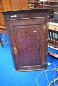 A 19th Century oak corner cupboard , height approx 114cm