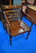 A modern hardwood carver chair in a classical style