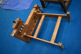 A vintage wooden work bench , with vices