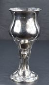An Edwardian silver Art Nouveau chalice of flared bluster form on a knopped stem and moulded