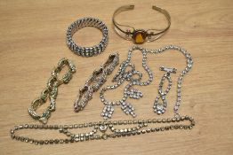 A collection of paste set costume jewellery including necklaces, bracelets and a silver cuff