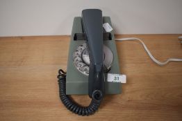 A vintage 1970s green trim phone.