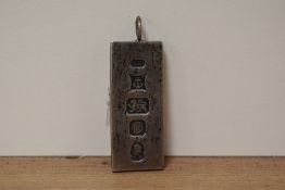 A hallmarked silver ingot.