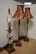 A pair of 20th Century French style table lamps, having copper coloured lamp shades, measuring