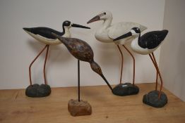 Four modern wooden wading birds, including oyster catcher and bittern.