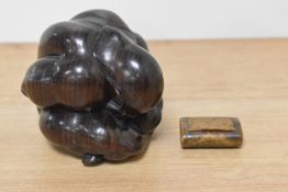 A carved hardwood weeping Buddha and an antique treen snuff box.