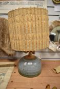 An interesting mid-20th Century studio pottery table lamp, the neck with applied and stylised