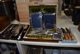 An assortment of vintage and antique flat ware, including Mother of Pearl handled knives and