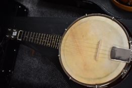 A traditional banjolele with case