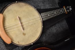 A traditional banjolele with case