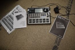 An Alesis SR18 drum machine