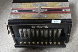 A vintage melodeon, marked Empress, Pammont & Smith