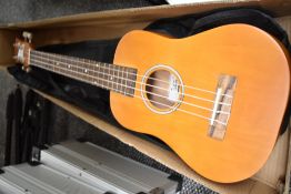 A modern Glarry ukulele in card box