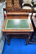 A Victorian mahogany davenport desk having raised back and turned supports