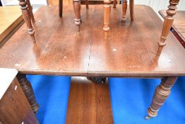 A Victorian oak wind out dining table, approx 138 x 122cm closed dimensions, with winder and