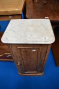 A 19th Century stained frame pot cupboard having marble top