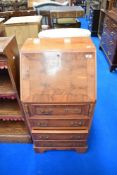 A reproduction yew wood dwarf bureau