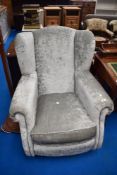 A modern silver grey upholstered armchair (DFS)