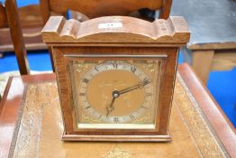 A vintage mahogany cased mantel clock having brass dial named for Elliott