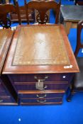 A reproduction two drawer filing cabinet