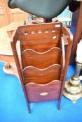 An Edwardian mahogany paper rack
