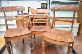 Three (two plus one) Victorian solid seat chairs having rail backs