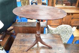 A 19th Century mahogany pedestal occasional table having oval top, turned column and triple splay