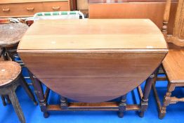 An early 20th century gateleg dining table having turned frame