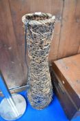 A modern wicker floor lamp