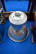 An industrial ceiling light fitting in aluminium casing