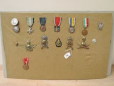 A collection of Italian Medals, Fascist Youth Badge x2, WWI Republic Long Service Cross 16 Years,