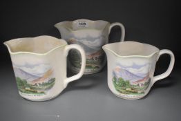 A trio of Nelson ware pitcher jugs, of Lake District interest, and decorated with a scene