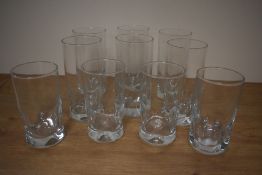 A group of ten mid-20th Century dimpled glass tumblers, the largest measure 15cm tall