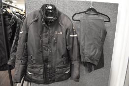A Lady Merlin ladies extra large padded motorbike jacket sold along with a pair of small, short