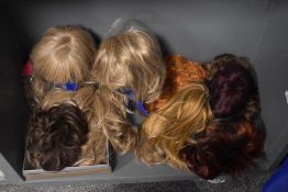 An assorted collection of vintage ladies wigs and hair pieces
