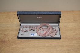 A matched set of rose quartz jewellery including earrings, necklace and two bracelets