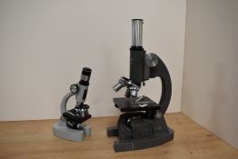 A Opax no.4123 microscope and a Prinz Optics model 180L zoom 100x-750x with user guide.