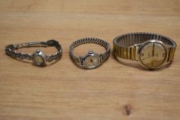A collection of wristwatches comprising a Smiths Empire, a Timex on an extending bracelet strap