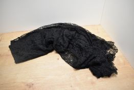 A 1930s two tone cream and black lace evening gown.