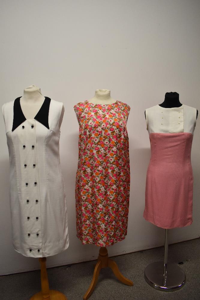 Three 1960s dresses, including pink and white fitted linen day dress and white linen dress with