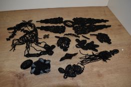 A selection of assorted black beaded clothes decorations, also included are hair clips and a