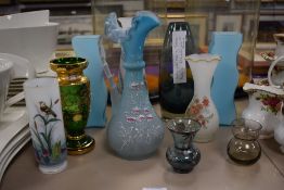 An collection of assorted glass vases including a small Whitefriers smoked glass vase, a smokey