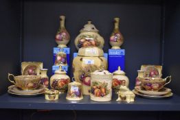 A collection of Aynsley Orchard Gold patterned items to include a lidded ginger jar, a pair of bud