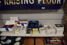 A collection of assorted small Swarovski trinkets including a two tulips, a gift and daisies etc.