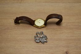 A gentleman's Sekonda wristwatch along with a floral design marcasite and pearl brooch.